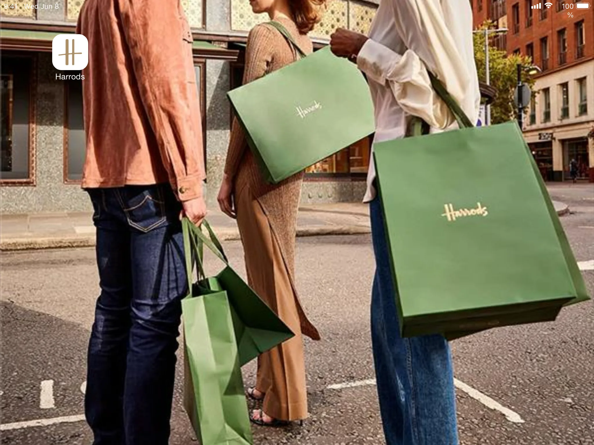 Harrods shopper application icon on iPad with shopping scene